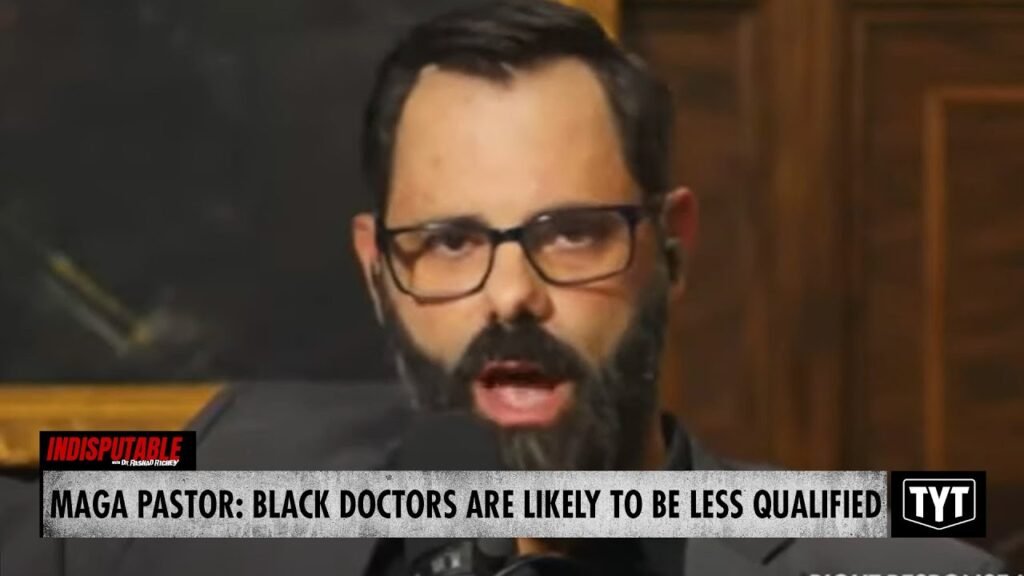 image for watch: maga pastor spits in faces of black doctors in latest hateful tirade