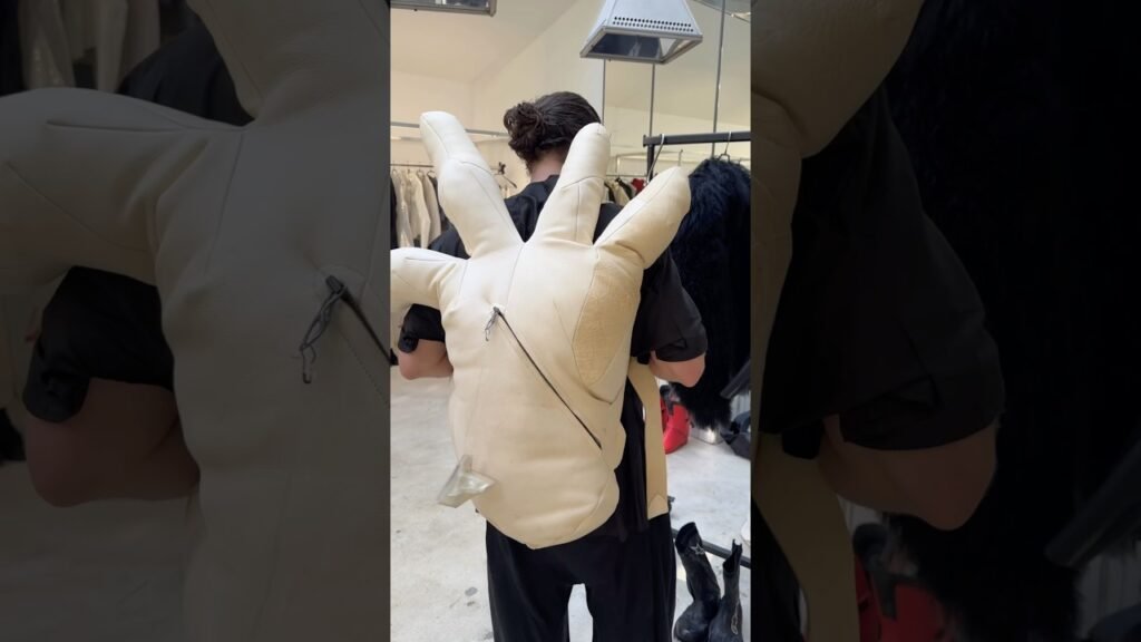image for backpack shaped like a hand 🎒